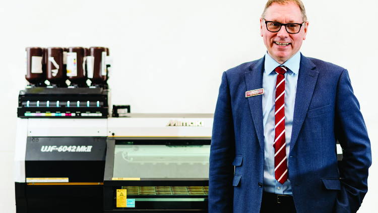 Badgemaster MD, Ian Bradbeer with one the company's new Mimaki UJF MkII LED UV flatbed printers. 